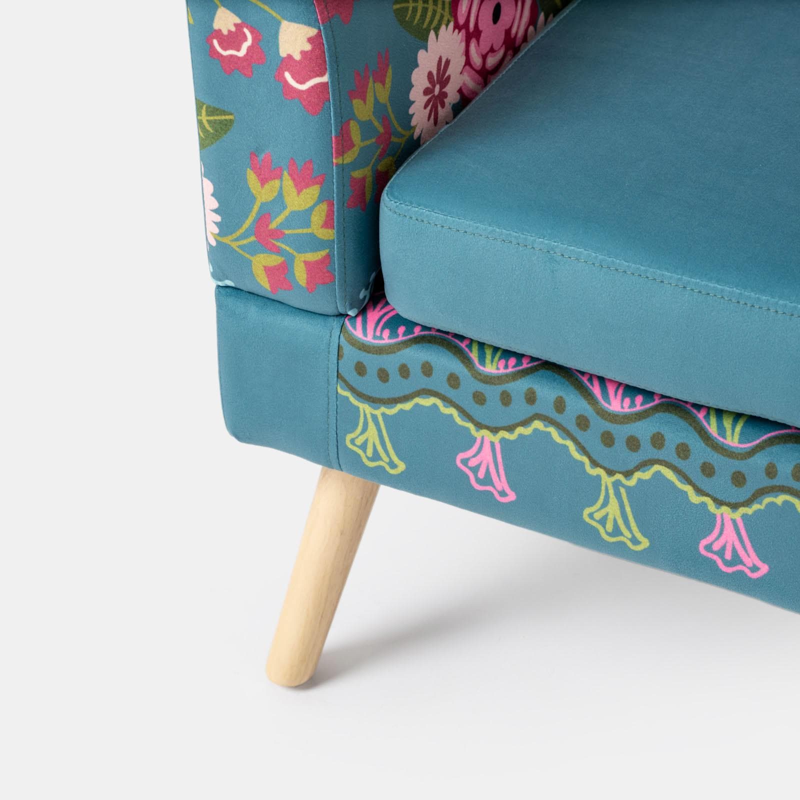 Poltrona in velluto turchese con fantasia floreale multicolore e gambe nere - Isadora